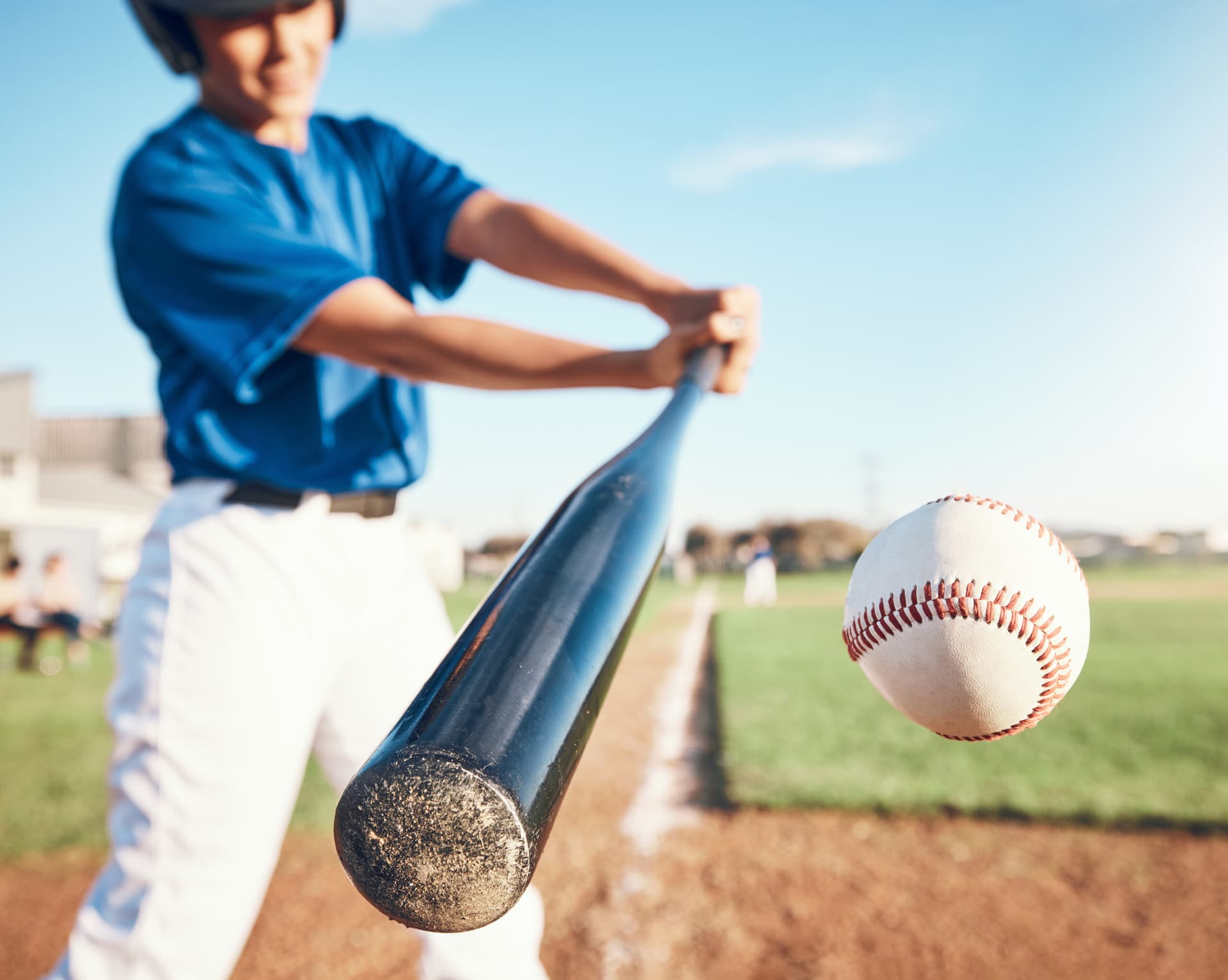 Baseball player hitting at bat during a game